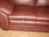 Tear in leather sofa